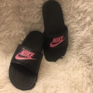 Pink and black Nike sandals